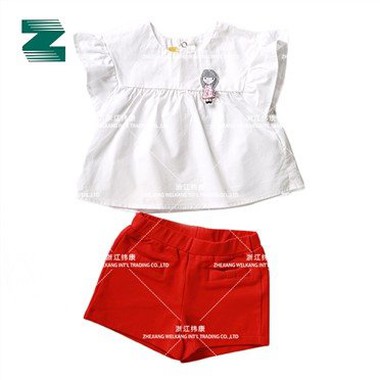 Blaus Untuk Kanak-Kanak Dalam Cotton Poplin Dengan Hiasan Tampalan Padding